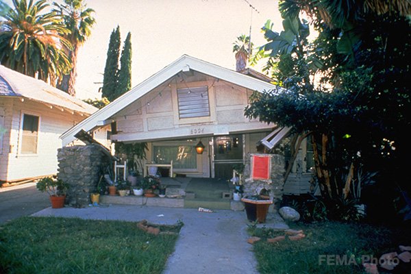 Image: Damaged house after 1994 Northridge earthquake, red-tagged due to uninhabitable structure. 