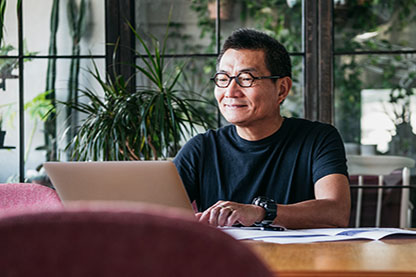 Image: Man on laptop - CRMP Program Rules