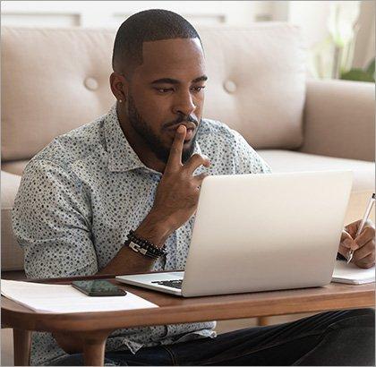 Image: Man looking at document