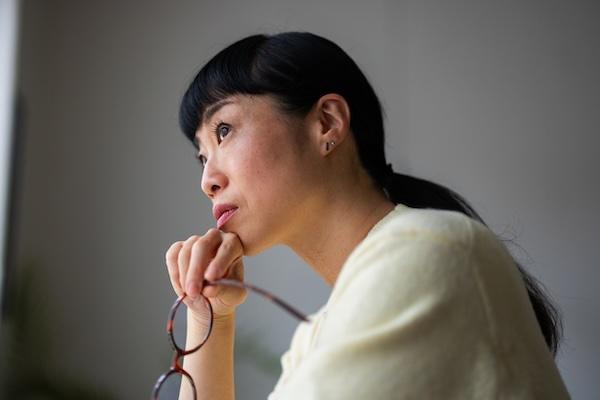 Woman contemplating image
